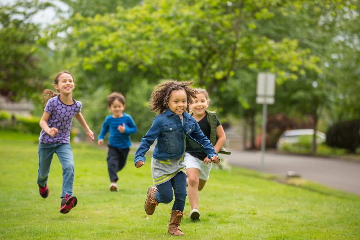 Friendly neighborhood children playing together outside